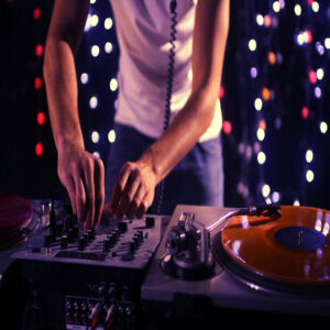 Photo of Vinyl DJ on Decks in Club